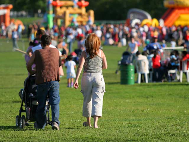 Carnival rides and colorful vendor tents at Fiesta Days in Frazier Park summer festival near Pine Mountain Club
