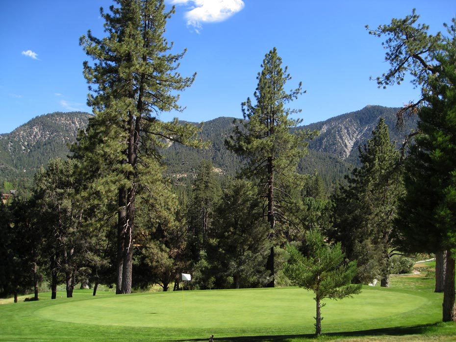 Evergreen trees lining fairway at Pine Mountain Club golf course