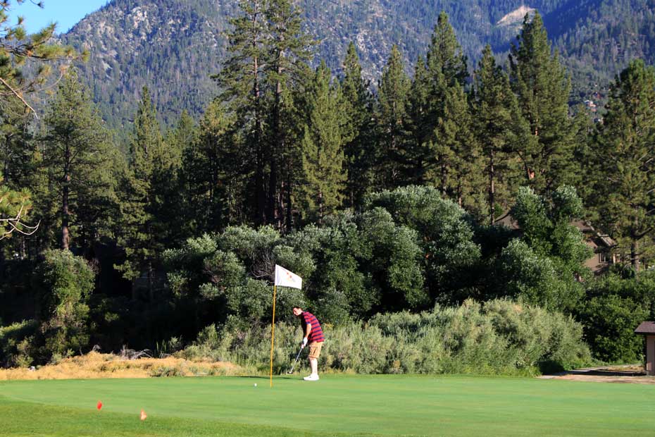 Golfer putting at Pine Mountain Club golf course