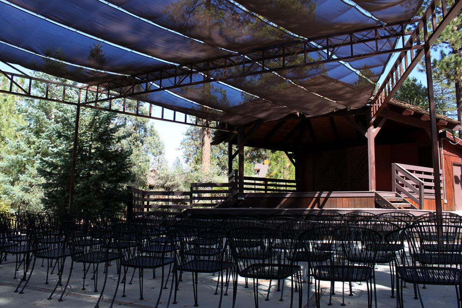 Covered outdoor event stage and seating area in Pine Mountain Club village