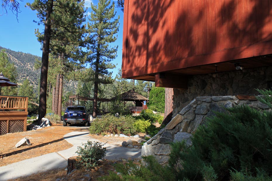 Red village building with stone landscaping in Pine Mountain Club