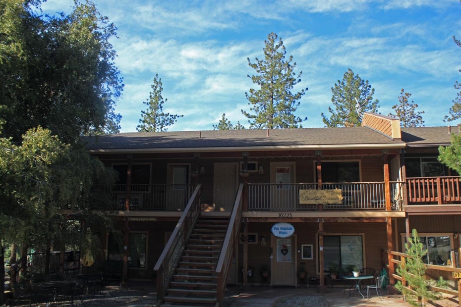 Two-story village shops with stairs and balconies in Pine Mountain Club