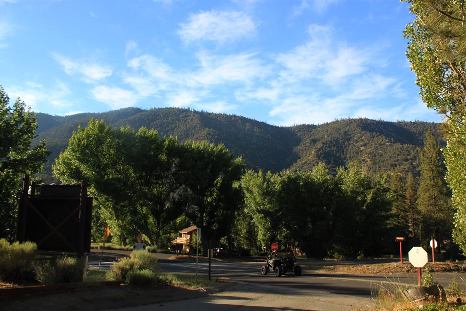 Pine Mountain Club village road with a mountain backdrop