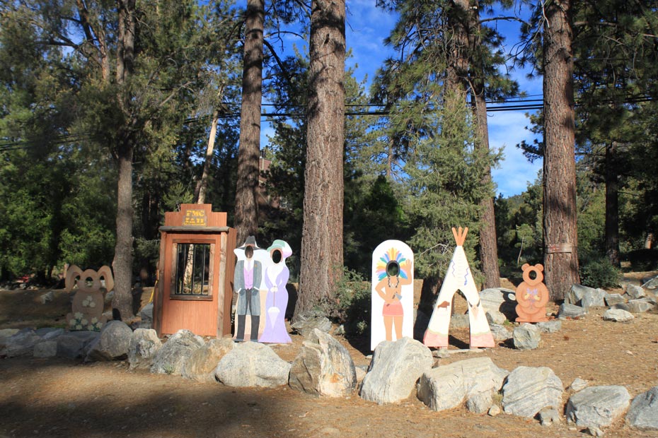 Decorative village sculpture and business signs in Pine Mountain Club