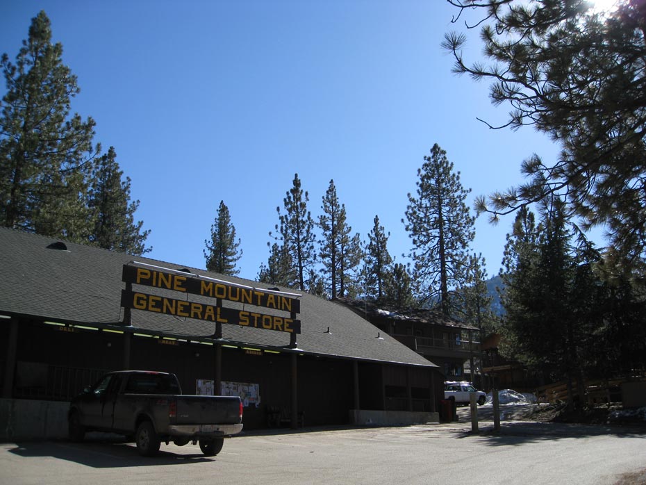 Pine Mountain Club village shopping center with mountain lodge storefronts