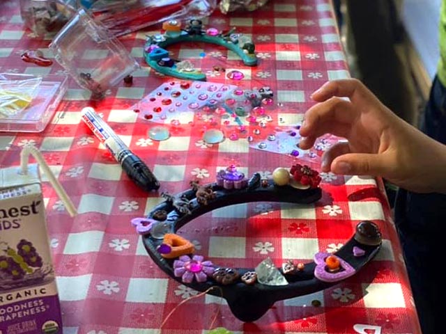Kids decorating horseshoes at Pine Mountain Club Equestrian Center art class