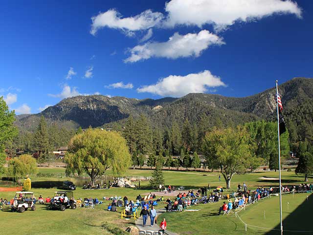 Live music at Concert On The Greens Pine Mountain Club golf course outdoor summer event with crowd and mountain views